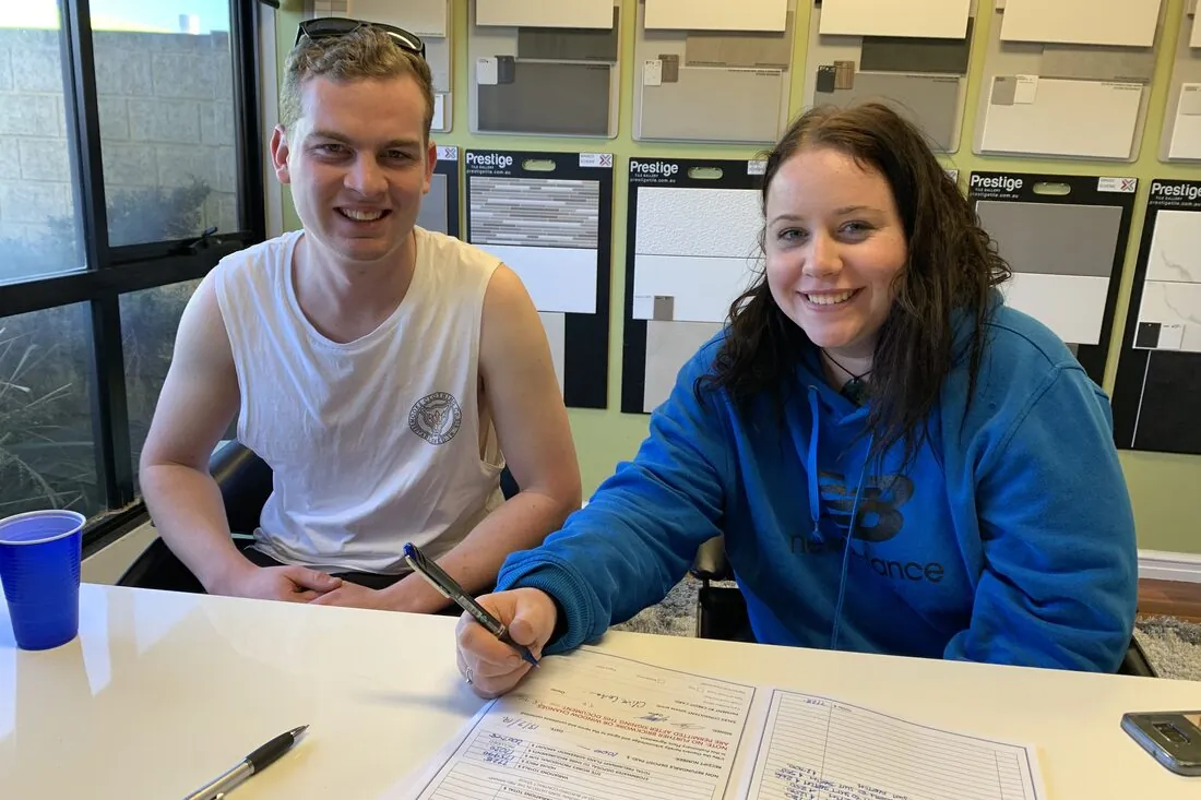 A young couple choosing the finishes for their new home