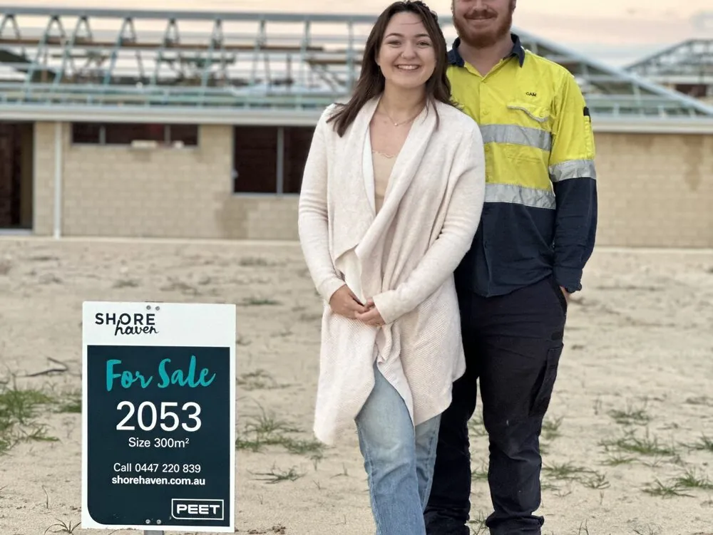 A first-home-buyer couple at their new block of land